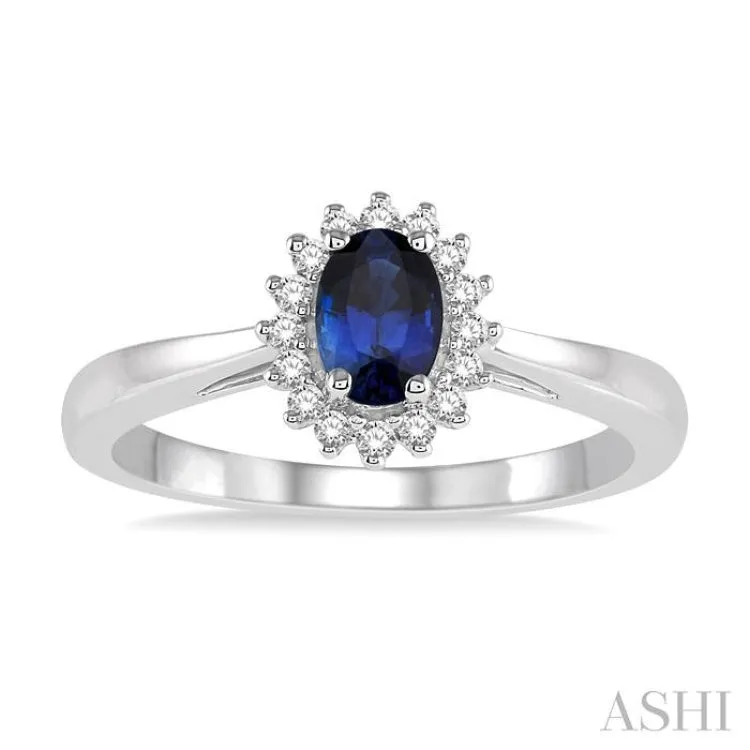 6X4MM Oval Cut Sapphire Center and 1/8 Ctw Round Cut Diamond Halo Precious Stone Ring in 10K White Gold